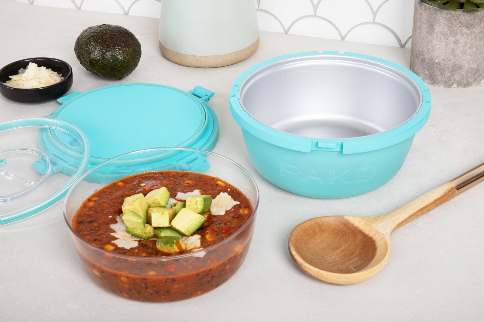 PAKD Power Bowl with a fresh meal, lid and inner container alongside